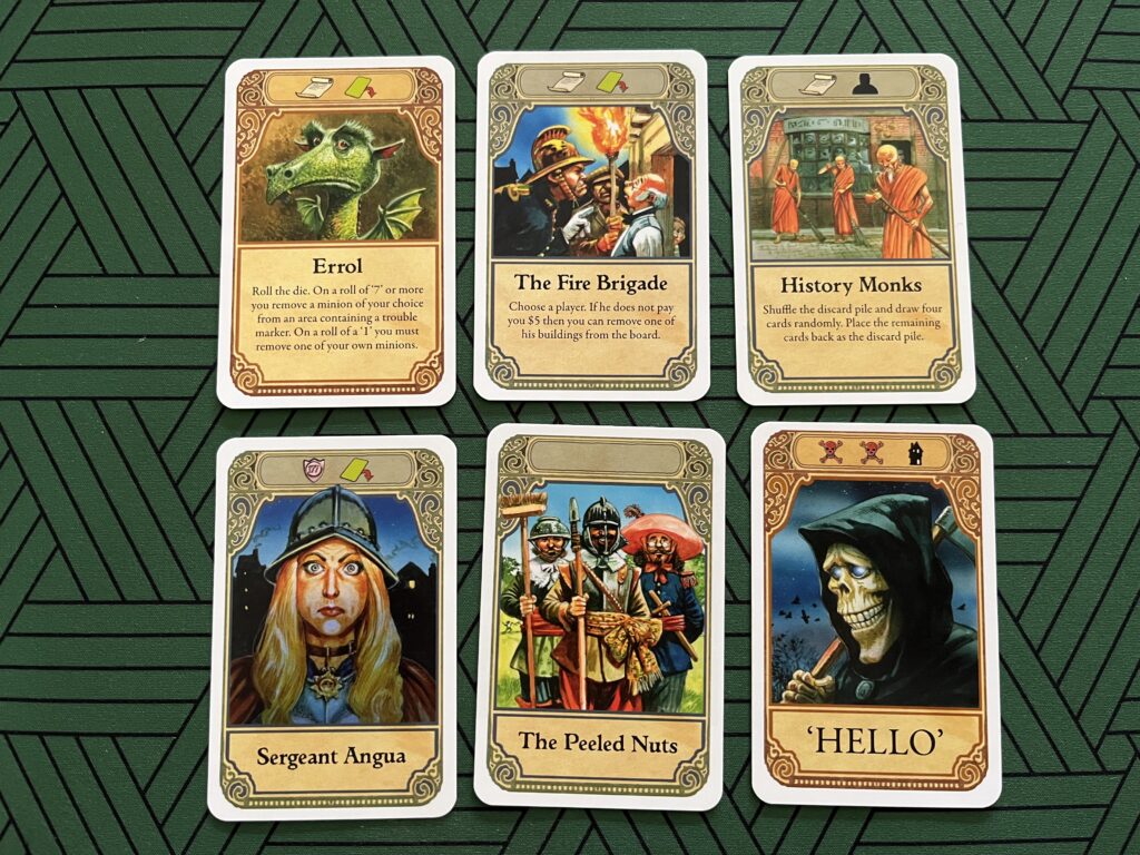 Photo of six player cards from the board game Discworld: Ankh-Morpork.
